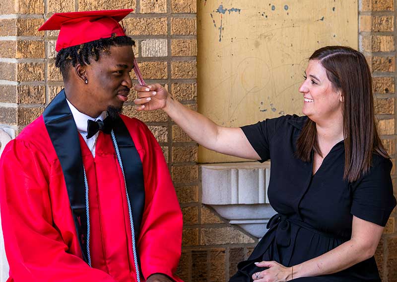 LifeSet participant, Brandon in his cap and gown with his specialist Claudia