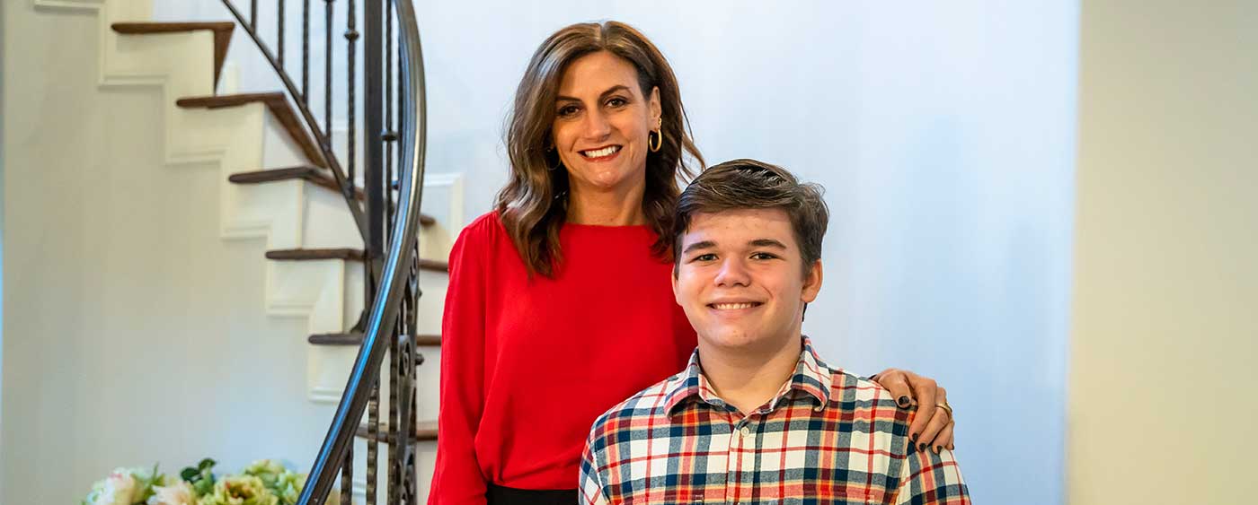 Amy and Aaron standing on staircase