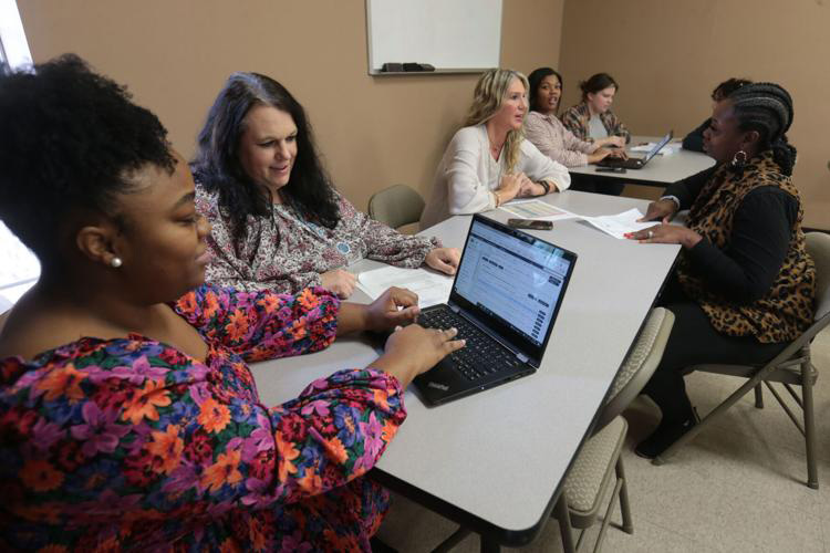 Youth Villages staff talking at a meeting