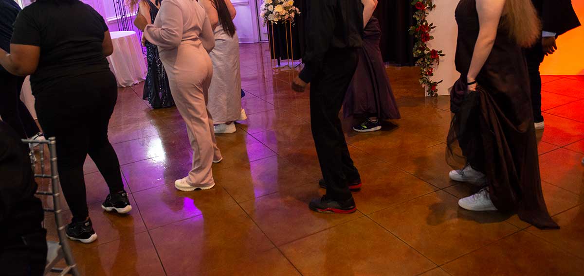 Youth and staff on the dance floor in their dress sneakers