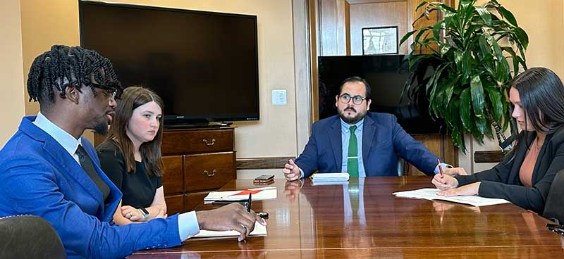 LifeSet participants, Brandon and Abby talking at a table with congress staff