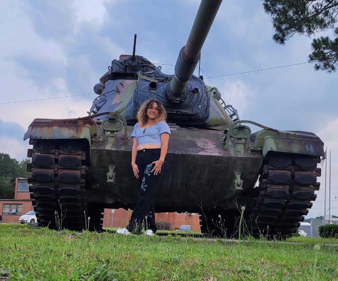 Jimena-2 Jimena poses in front of army tank amid dreams of enlisting in military