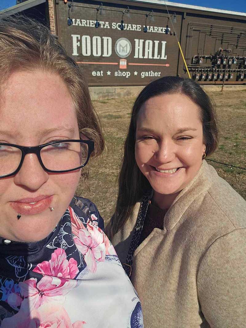 Lauren spends quality time with mentee, Ky at a food hall in Marietta, GA