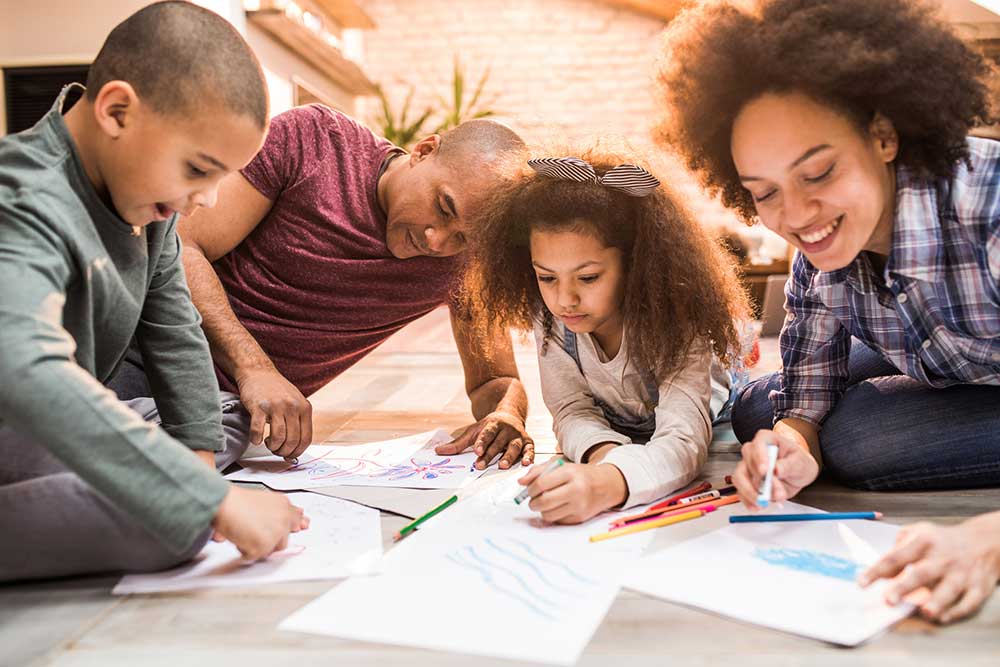 Young family drawing and coloring