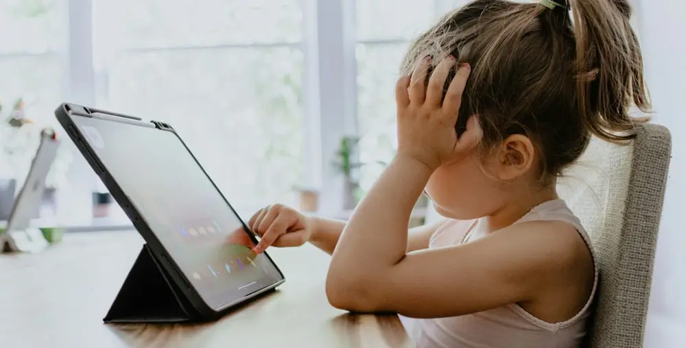 young girl on a tablet