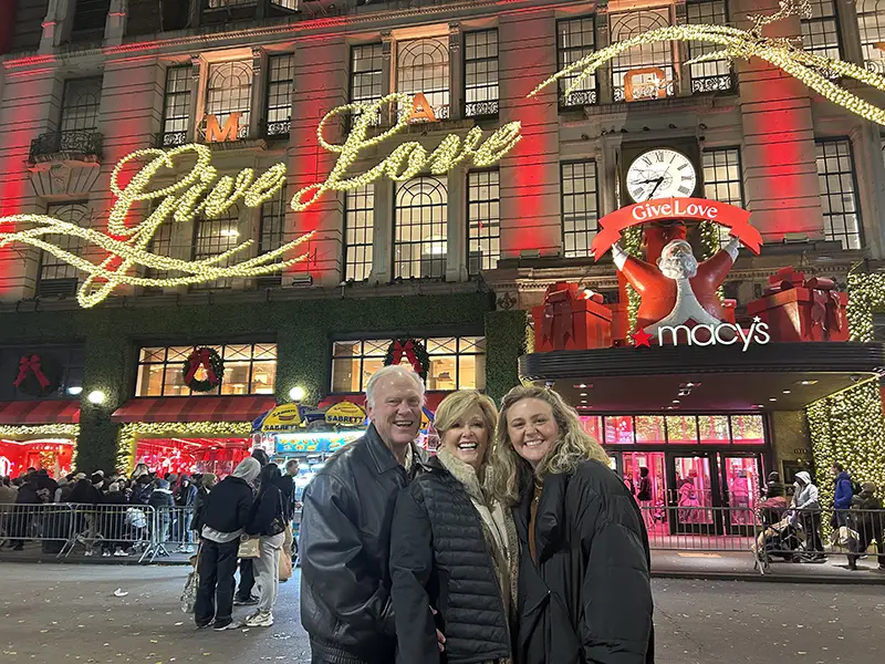 Candler family in front of Macy's store during the winter holidays